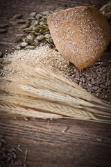 fresh bread and wheat on the wooden - rustic