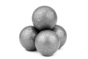 Stack of four lead musket balls on white