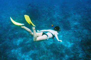 Woman with mask snorkeling