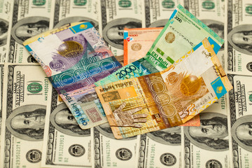 Fototapeta na wymiar Kazakh tenge and U.S. dollars
