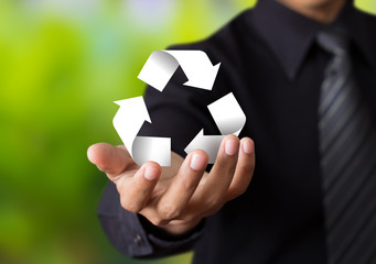 Paper recycle sign in business man hand
