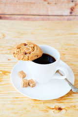cup of black coffee and cookies