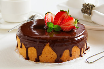 Sponge cake with chocolate cream and strawberries.