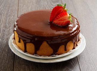 Sponge cake with chocolate cream and strawberries.