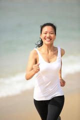 woman running at beach