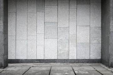 Empty urban interior with stone wall and concrete floor pavement