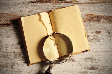 notebook and magnifying glass