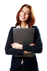 Cheerful businesswoman holding laptop 