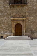 Fototapeta na wymiar beautiful old wooden door with old wall texture