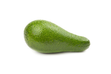 Green avocado with water drops