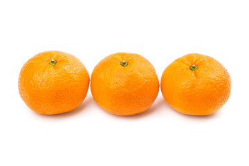 Close-up of three sweet mandarins