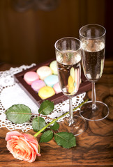 Two glasses of sparkling wine or champagne with small colorful