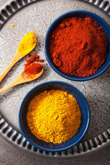 spices in bowls: curry and paprika powder