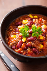 mexican chili con carne in black bowl