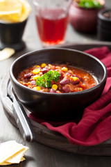 mexican chili con carne in black bowl