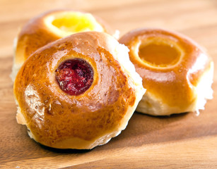 Rolls with jam on a wooden table