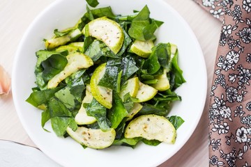 Green salad with zucchini, spinach, spring fresh, healthy dish