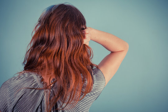 Young woman tuching her hair