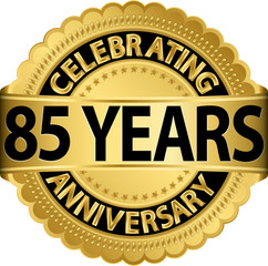 Celebrating 85 years anniversary golden label with ribbon, vecto