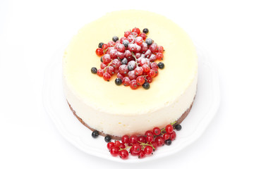 cheesecake with red and black currants, isolated