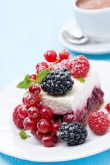 dessert - a piece of cake with fresh berries on the plate