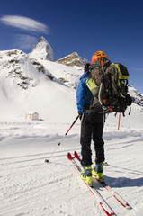 skier looking at snow covered mountains