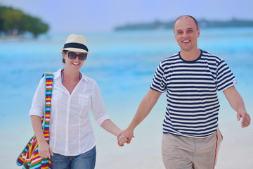 happy young couple have fun on beach