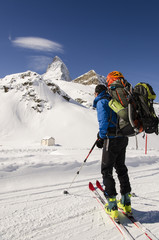 Fototapeta na wymiar skier looking at snow covered mountains