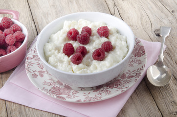 warm rice pudding with raspberry