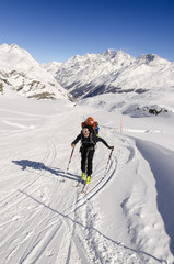 Naklejka na ściany i meble Touring skier in Swiss Alps