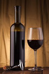 corkscrew glass  and wine bottle