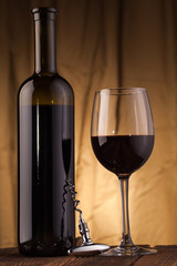 corkscrew glass  and wine bottle
