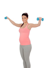 Pregnant woman doing exercise with dumbbells