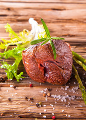 Grilled steaks on wood 