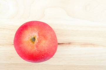 Fresh apples on the wooden floor