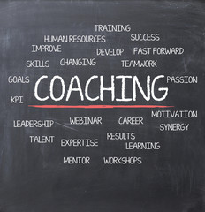 Coaching concept on blackboard