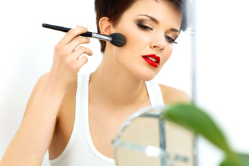 Beauty Girl with Makeup Brush and Red Lips.