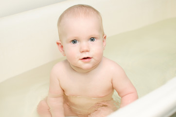 baby is bathed in light bathroom