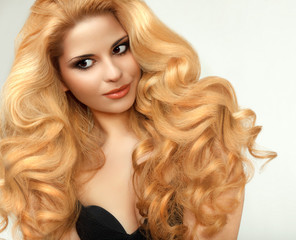 Blonde Hair. Portrait of beautiful blonde with Healthy Long Hair