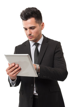 Business man checking his ipad for stock market news