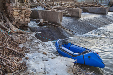 packraft and river dam