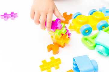 Baby hand playing block toy