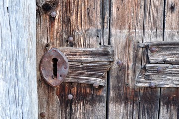 Detail of old brown wooden door
