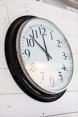 wall clock on old wooden background