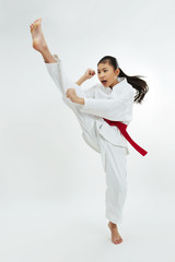 young taekwondo girl kicking - 62275651
