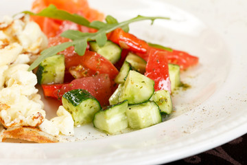 Scrambled eggs with salmon and vegetables