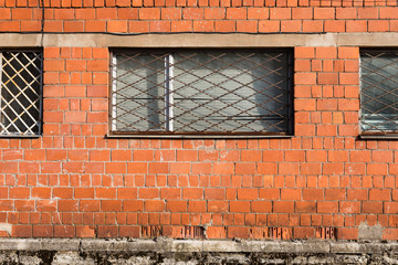 Brick wall with metal window bars