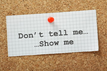 Don't Tell Me,Show Me on a Cork Notice Board - obrazy, fototapety, plakaty