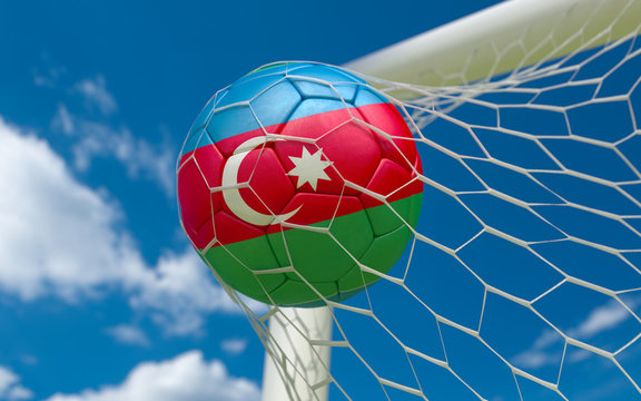 Flag of Azerbajan and soccer ball in goal net