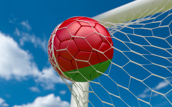 Flag of Belarus and soccer ball in goal net